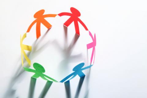Circle of Multi-colored Paper People Cutouts